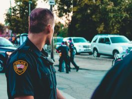 man wearing black officer uniform